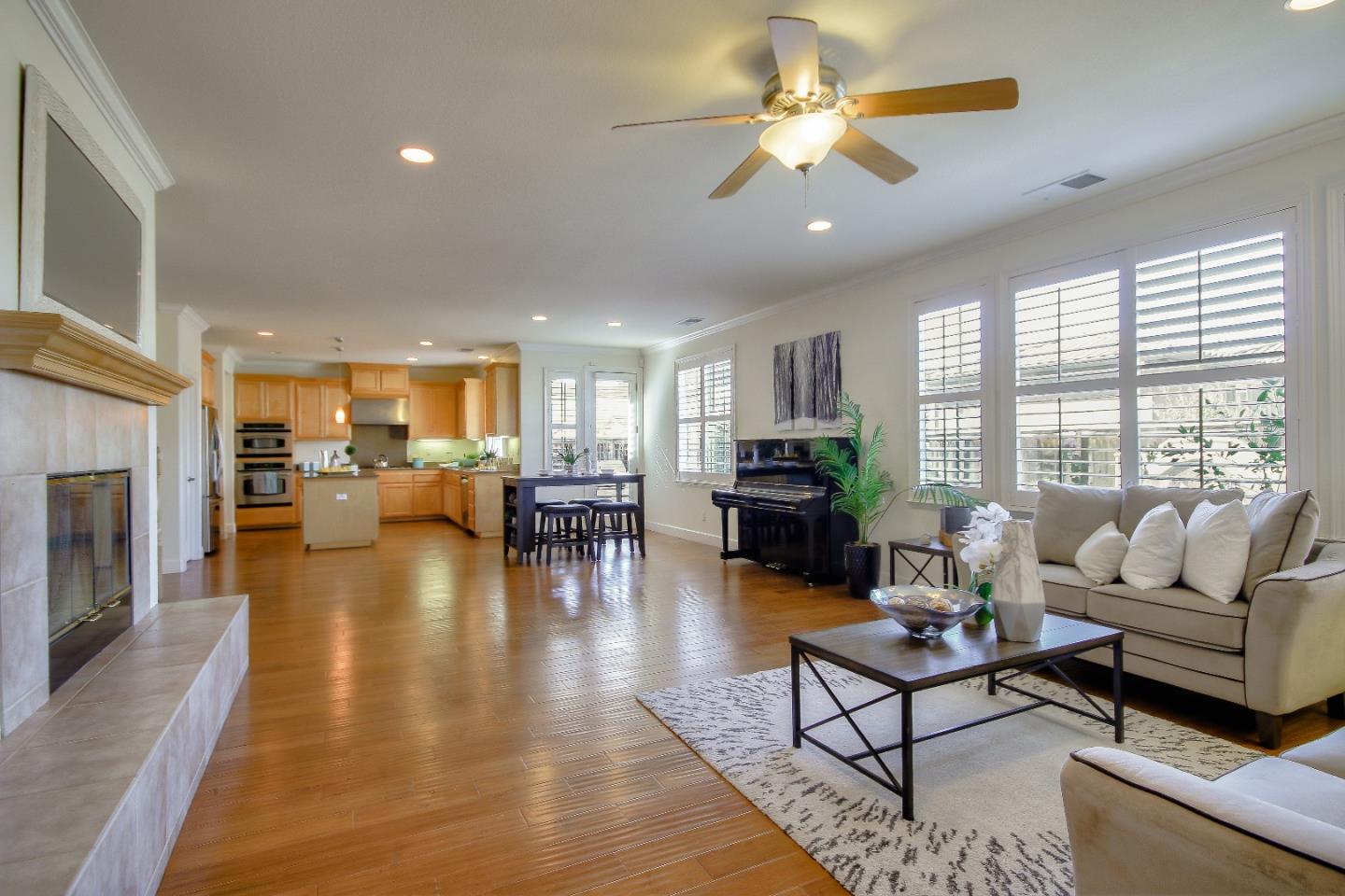 2893 Bethany Road San Ramon, CA 94582 - Photo 9 of 43 a living room with fireplace furniture and a table
