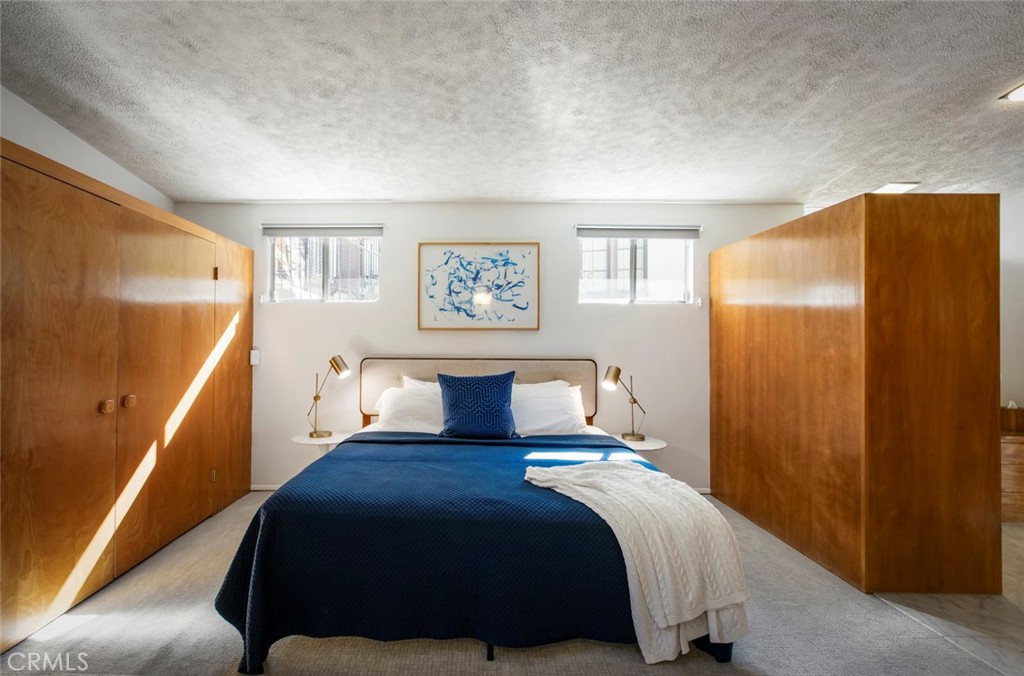 2820 East Chevy Chase Drive Glendale, CA 91206 - Photo 30 of 55 a bedroom with a bed and a window