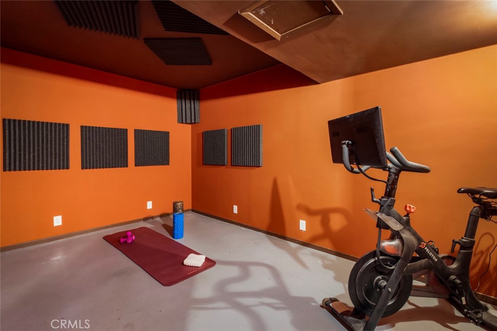2820 East Chevy Chase Drive Glendale, CA 91206 - Photo 44 of 55 a room with gym equipment and a flat screen tv