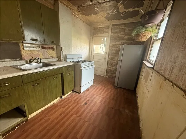 a bathroom with a sink and mirror