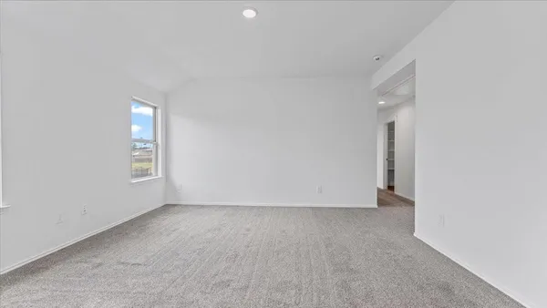 an empty room with a empty space and windows