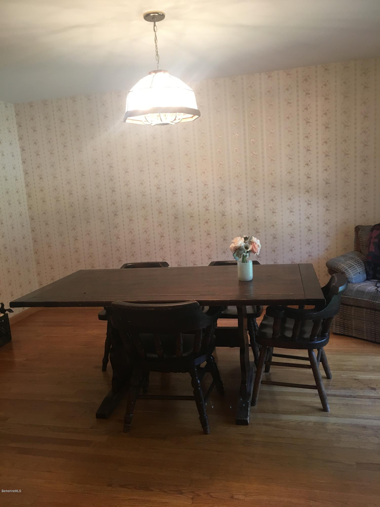 560 Loop Road Savoy, MA 01256 - Photo 22 of 44 a view of a dining room with furniture and wooden floor