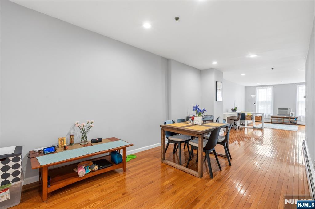 258 Old River Road Edgewater, NJ 07020 - Photo 13 of 32 a workspace with furniture and wooden floor
