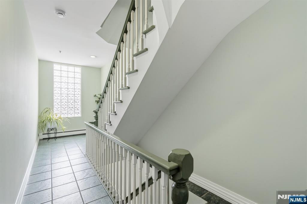 258 Old River Road Edgewater, NJ 07020 - Photo 17 of 32 a view of entryway with stairs and wooden floor