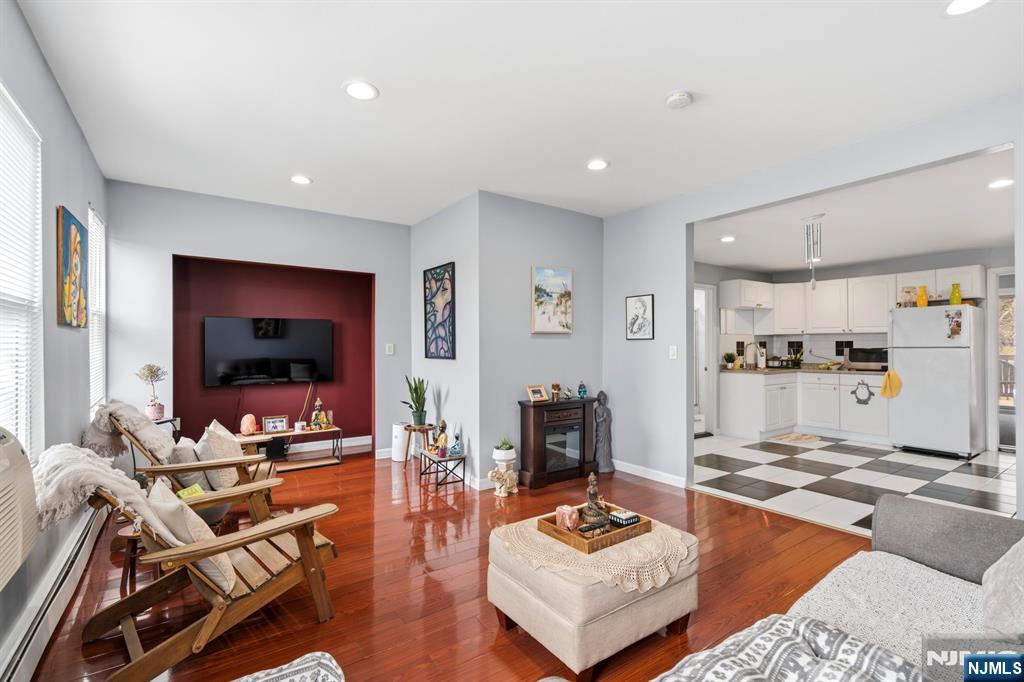 258 Old River Road Edgewater, NJ 07020 - Photo 20 of 32 a living room with furniture and a flat screen tv