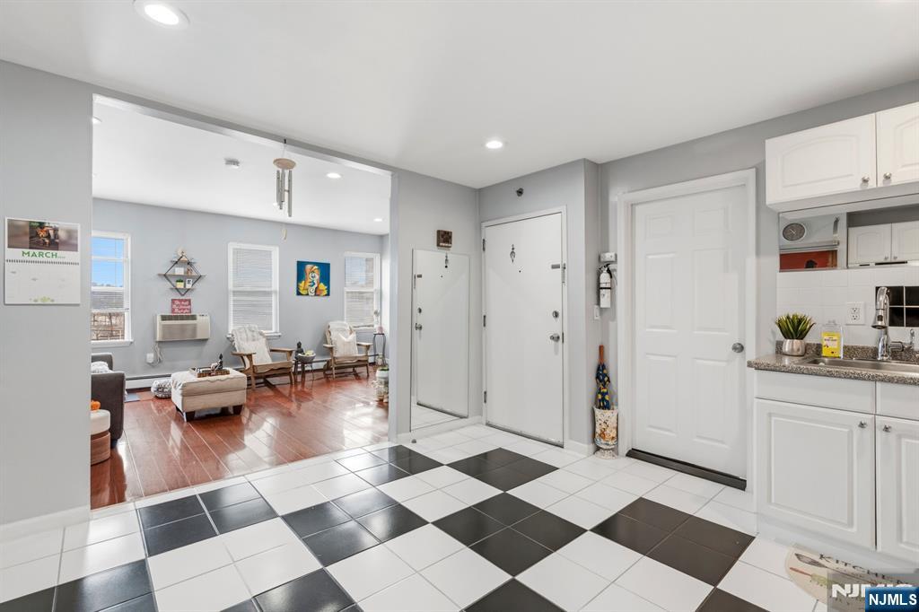 258 Old River Road Edgewater, NJ 07020 - Photo 23 of 32 a living room with furniture and a rug