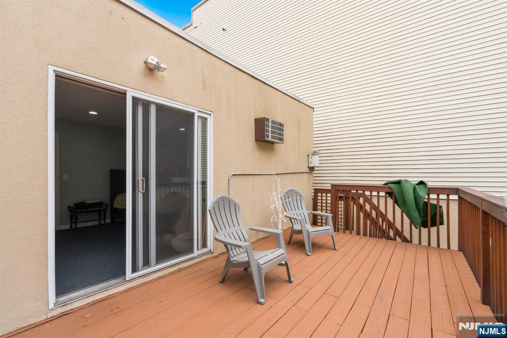258 Old River Road Edgewater, NJ 07020 - Photo 26 of 32 a balcony with table and chairs