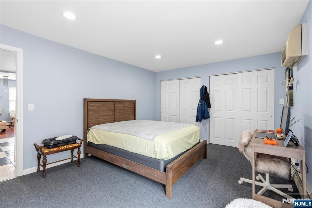 258 Old River Road Edgewater, NJ 07020 - Photo 27 of 32 a bedroom with a bed and a table in it