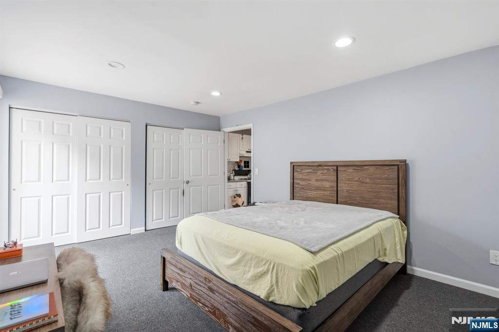 258 Old River Road Edgewater, NJ 07020 - Photo 29 of 32 a bedroom with a bed and a window
