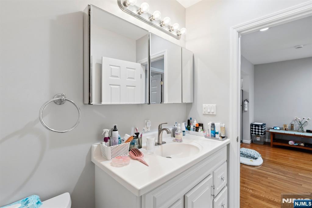 258 Old River Road Edgewater, NJ 07020 - Photo 9 of 32 a bathroom with a sink and a mirror