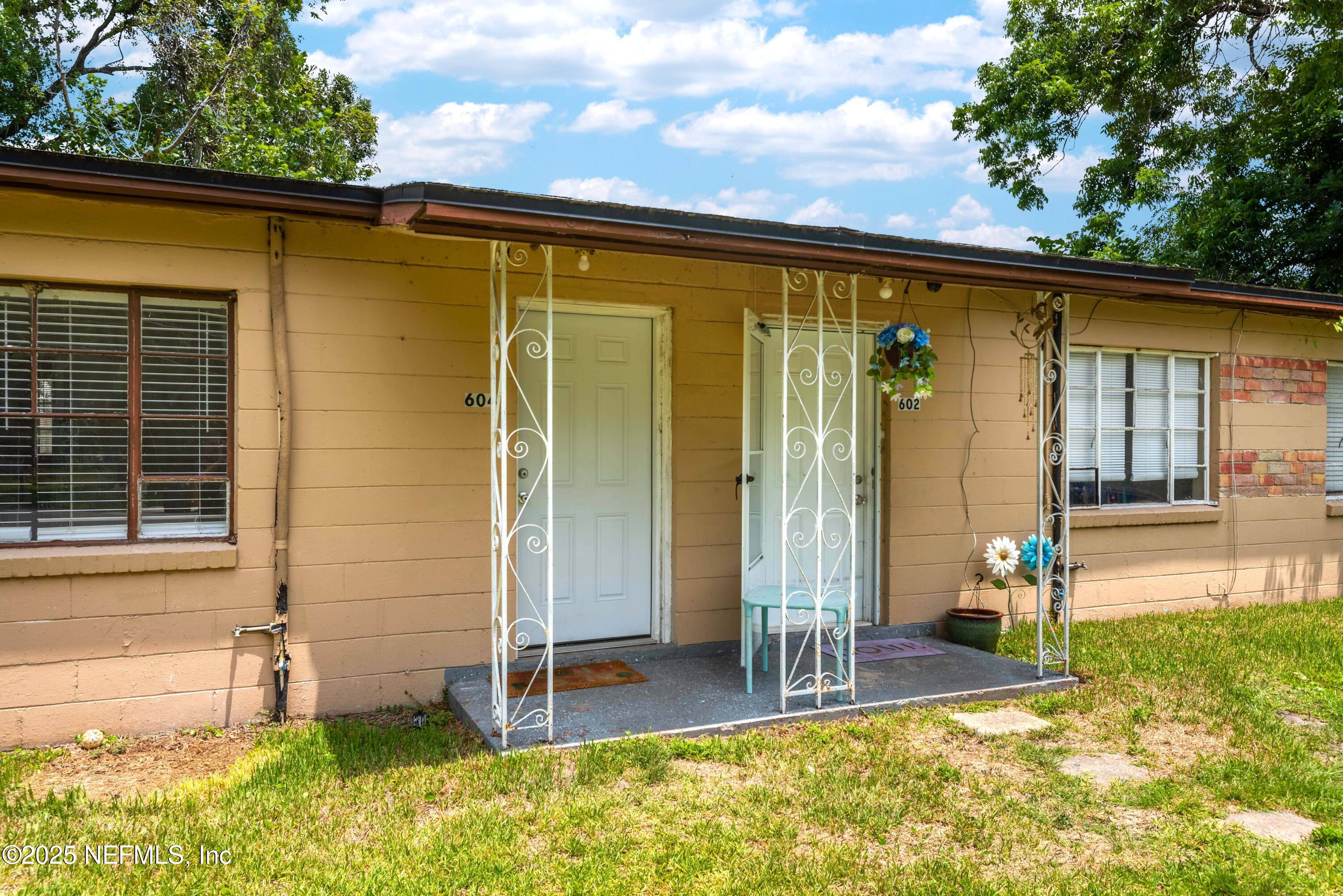 a backyard of a house with seating space