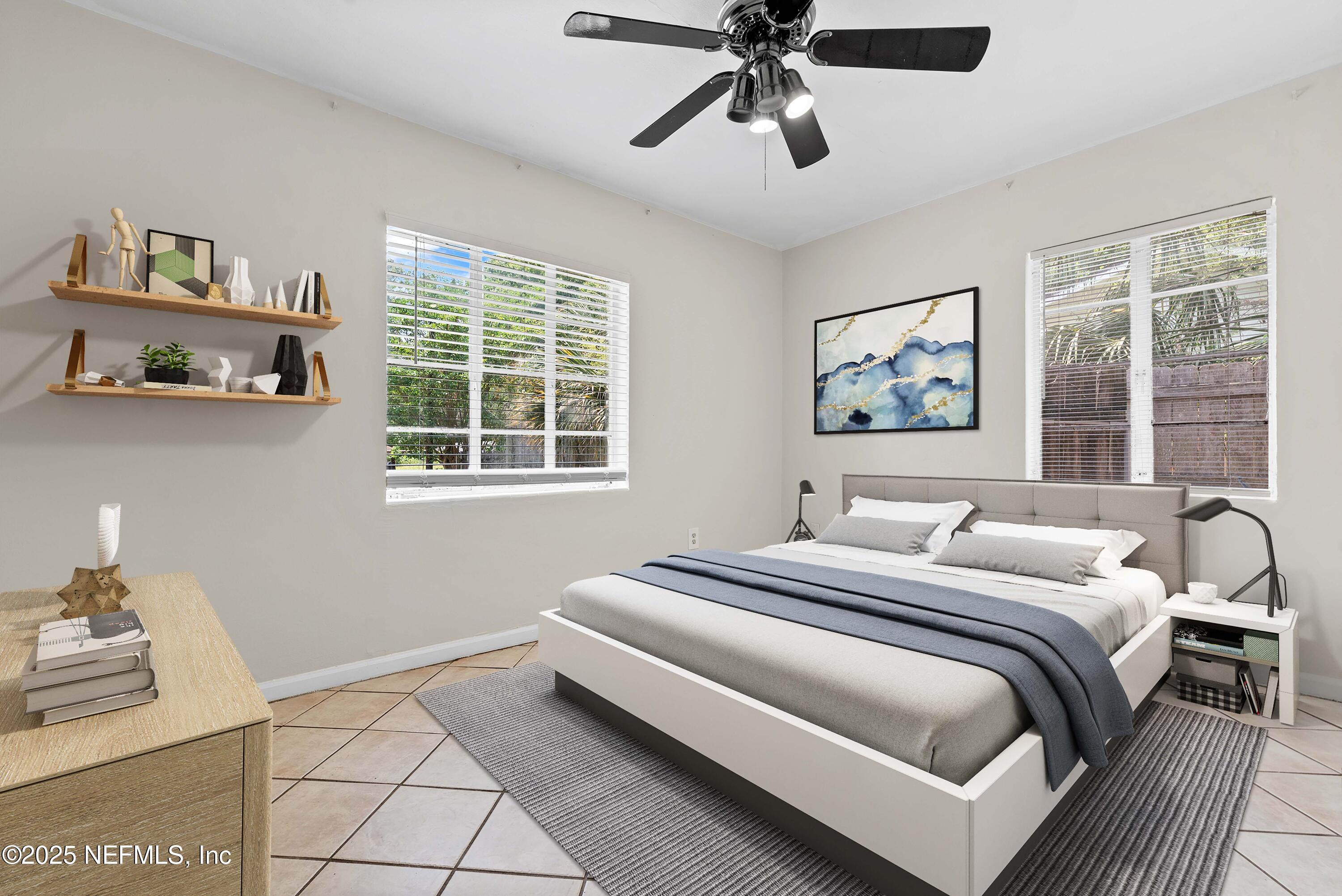 602 Luna Court Jacksonville, FL 32205 - Photo 14 of 16 a bedroom with a bed and a window