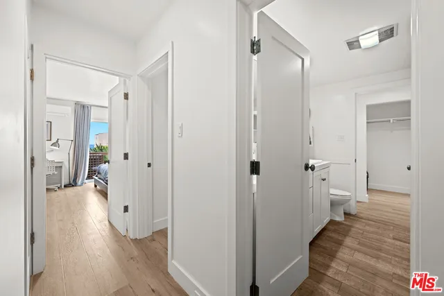 a bathroom with a sink and a glass door shower