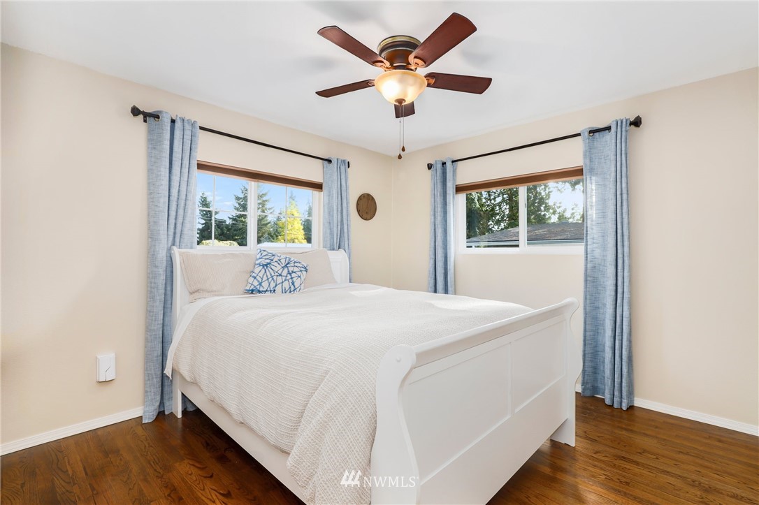24118 2nd Place West Bothell, WA 98021 - Photo 13 of 25 a bedroom with a large bed and a large window