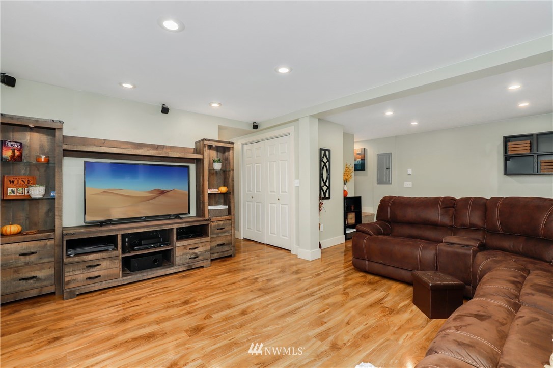 24118 2nd Place West Bothell, WA 98021 - Photo 17 of 25 a living room with furniture and a flat screen tv