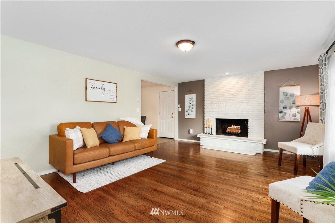 24118 2nd Place West Bothell, WA 98021 - Photo 3 of 25 a living room with furniture and a fireplace
