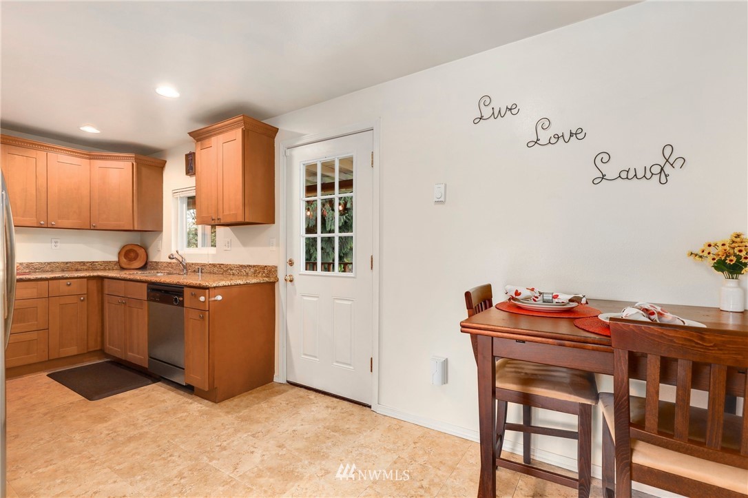 24118 2nd Place West Bothell, WA 98021 - Photo 6 of 25 a kitchen with cabinets and wooden floor