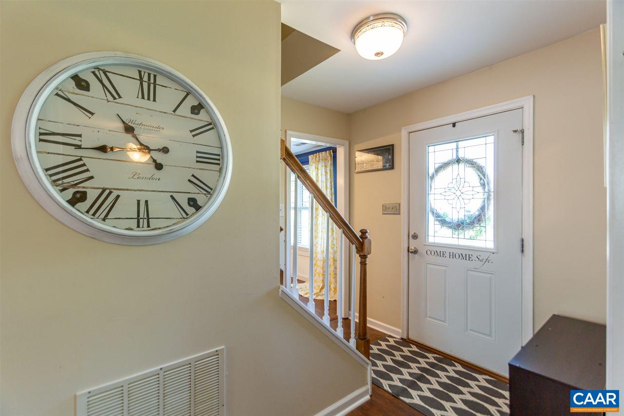 194 Ruckersville Heights Road Ruckersville, VA 22968 - Photo 13 of 38 an entryway with wooden floor a rug a mirror and a window