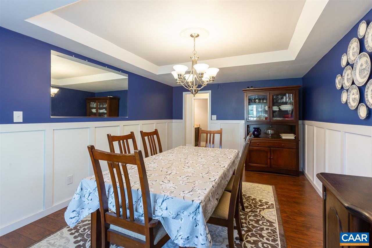 194 Ruckersville Heights Road Ruckersville, VA 22968 - Photo 20 of 38 a view of a dining room with furniture and wooden floor