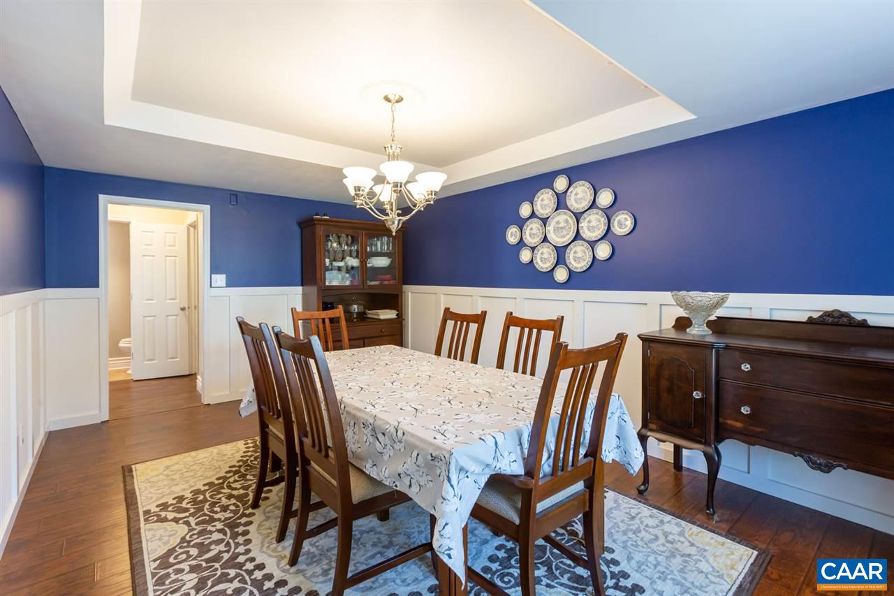 194 Ruckersville Heights Road Ruckersville, VA 22968 - Photo 21 of 38 a view of a dining room with furniture and chandelier