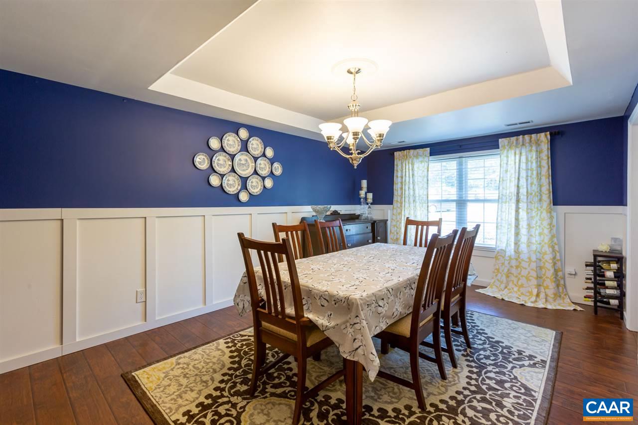 194 Ruckersville Heights Road Ruckersville, VA 22968 - Photo 22 of 38 a view of a dining room with furniture a chandelier and wooden floor