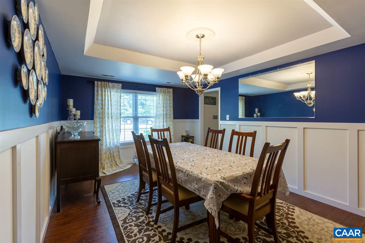 194 Ruckersville Heights Road Ruckersville, VA 22968 - Photo 23 of 38 a view of a dining room with furniture and chandelier
