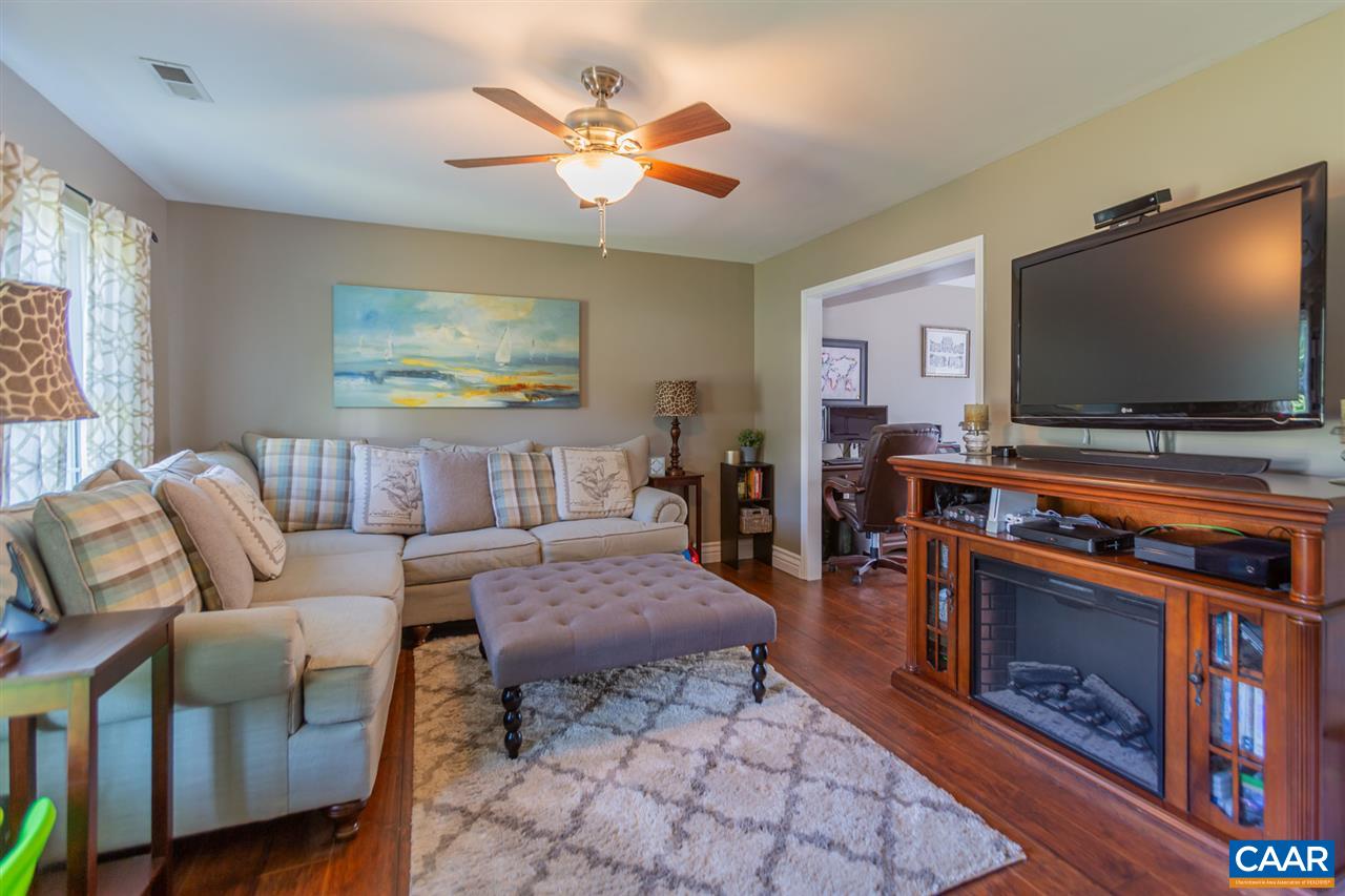 194 Ruckersville Heights Road Ruckersville, VA 22968 - Photo 26 of 38 a living room with furniture and a flat screen tv