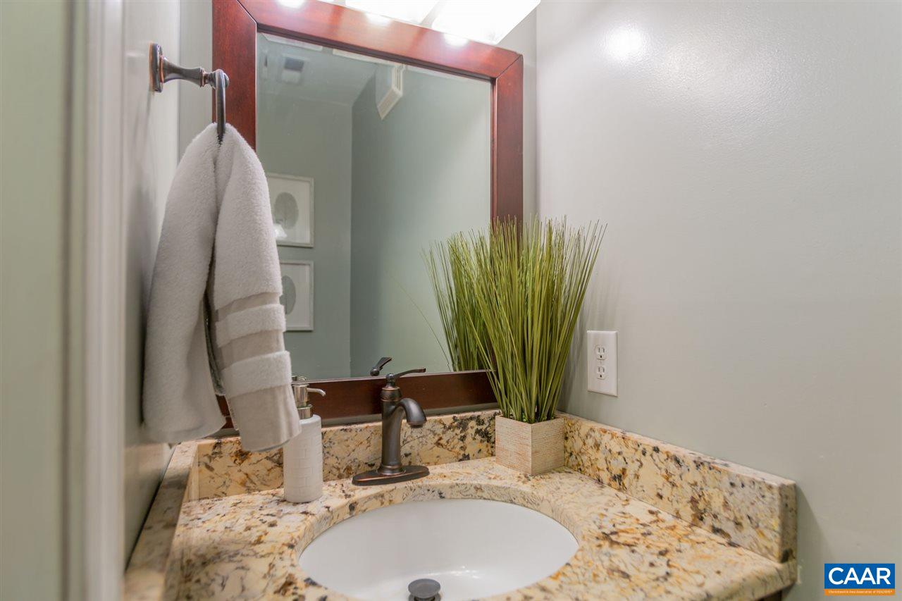 194 Ruckersville Heights Road Ruckersville, VA 22968 - Photo 28 of 38 a bathroom with a granite countertop sink and a mirror