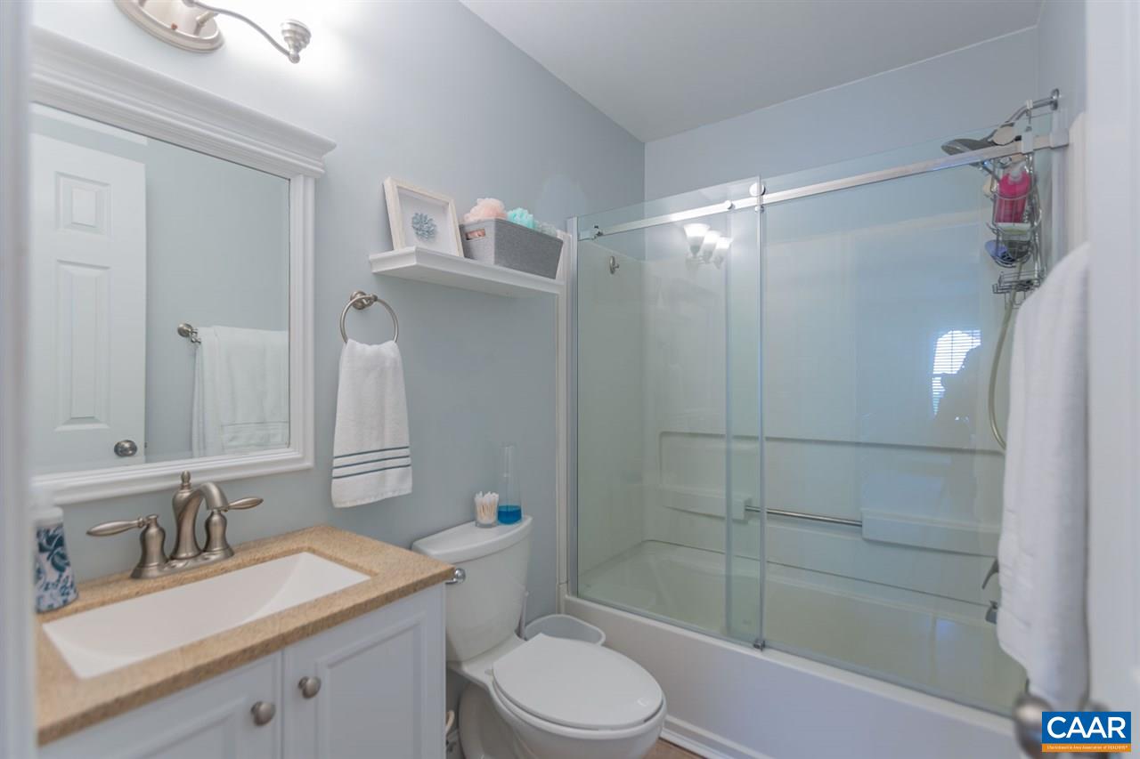 194 Ruckersville Heights Road Ruckersville, VA 22968 - Photo 33 of 38 a bathroom with a sink toilet vanity and shower