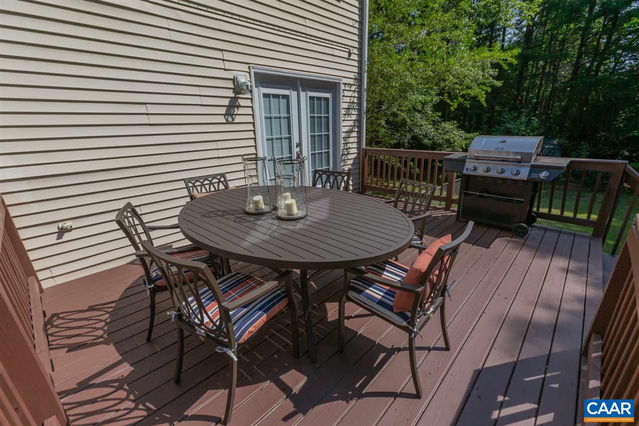 194 Ruckersville Heights Road Ruckersville, VA 22968 - Photo 10 of 38 a view of a roof deck with table and chairs with wooden floor and fence