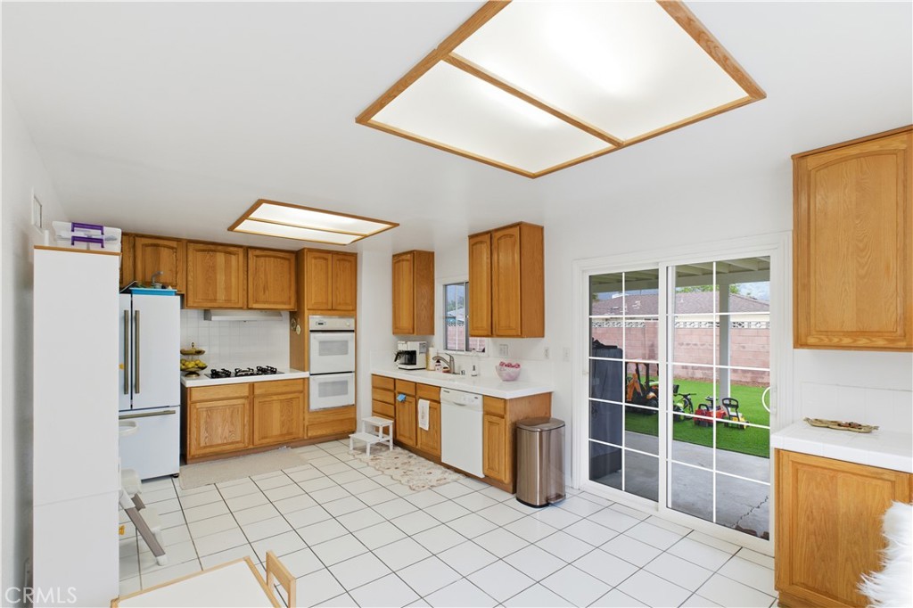 6290 Cynthia Street Simi Valley, CA 93063 - Photo 15 of 32 a kitchen with stainless steel appliances a stove a sink and a refrigerator