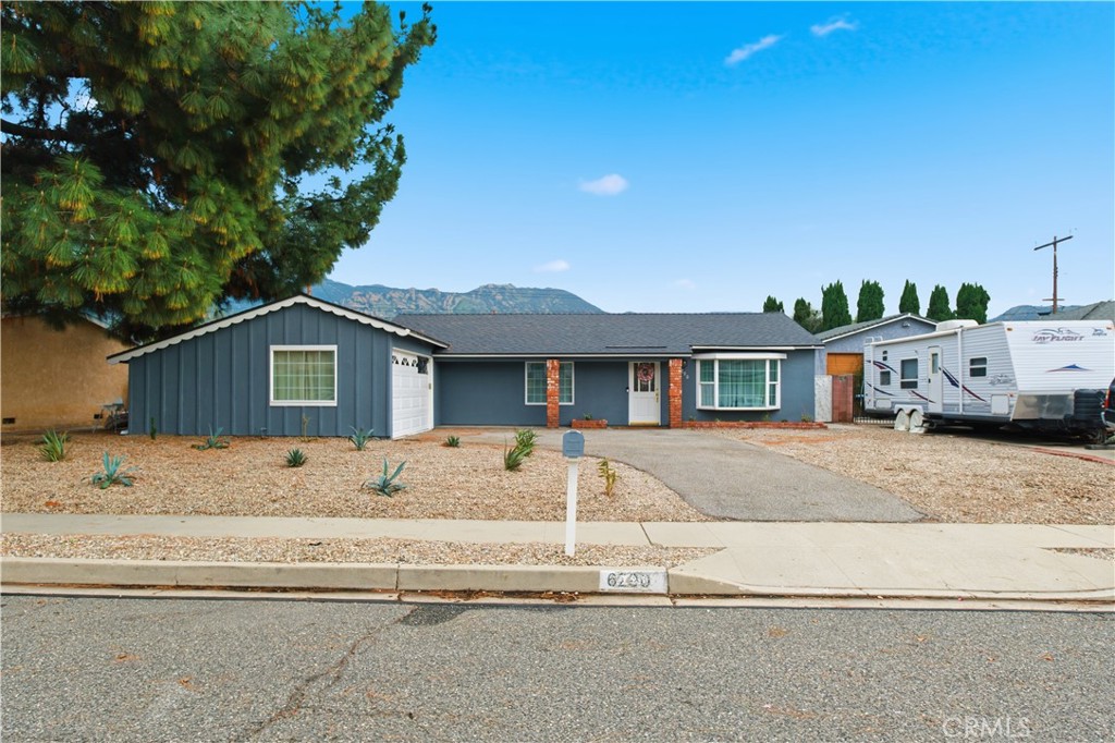 6290 Cynthia Street Simi Valley, CA 93063 - Photo 2 of 32 a front view of a house with a yard