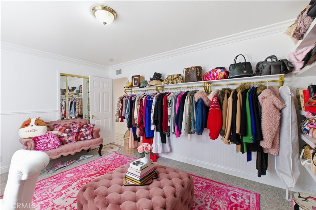 6290 Cynthia Street Simi Valley, CA 93063 - Photo 26 of 32 a view of walk in closet with clothes and shoes