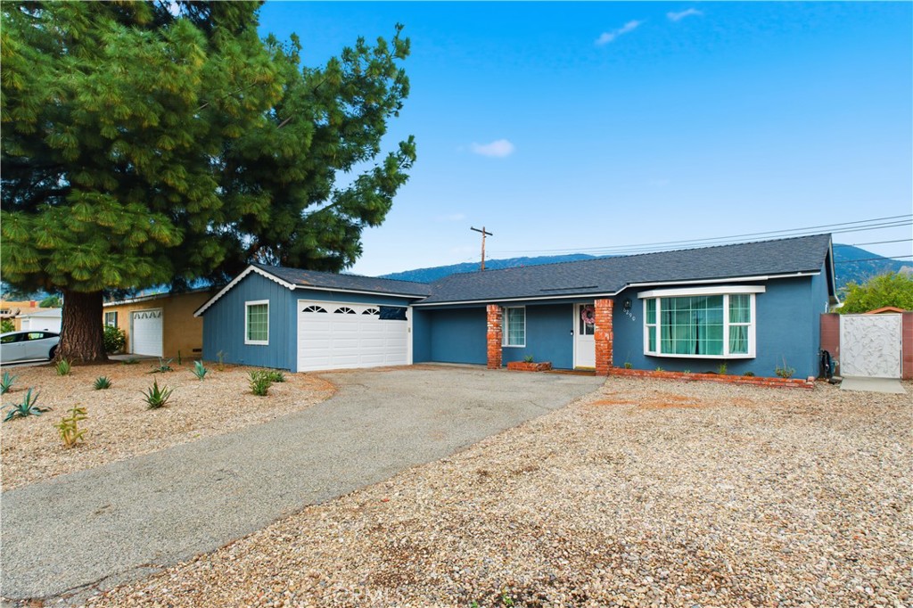 6290 Cynthia Street Simi Valley, CA 93063 - Photo 5 of 32 a front view of a house with a yard