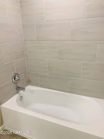 a white toilet sitting next to a white sink