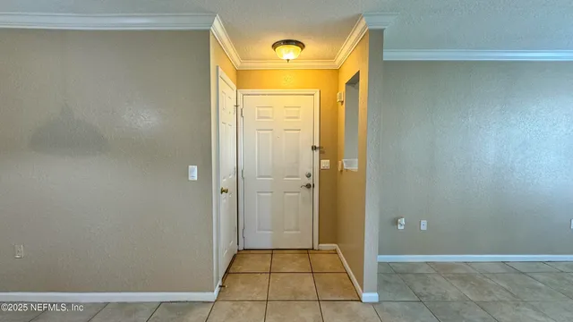 a view of a bathroom with a glass door and a window