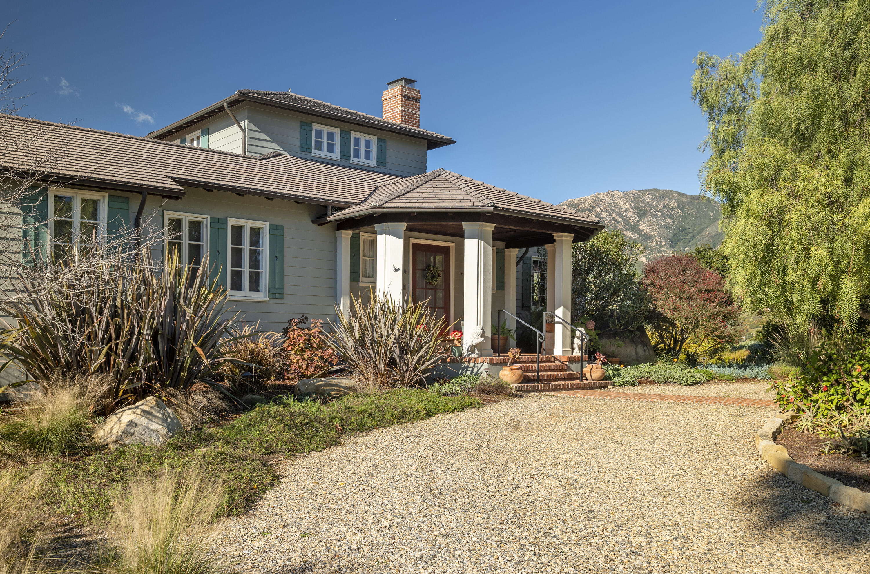 1138 Mission Ridge Road Santa Barbara, CA 93103 - Photo 13 of 54 a front view of a house with a yard