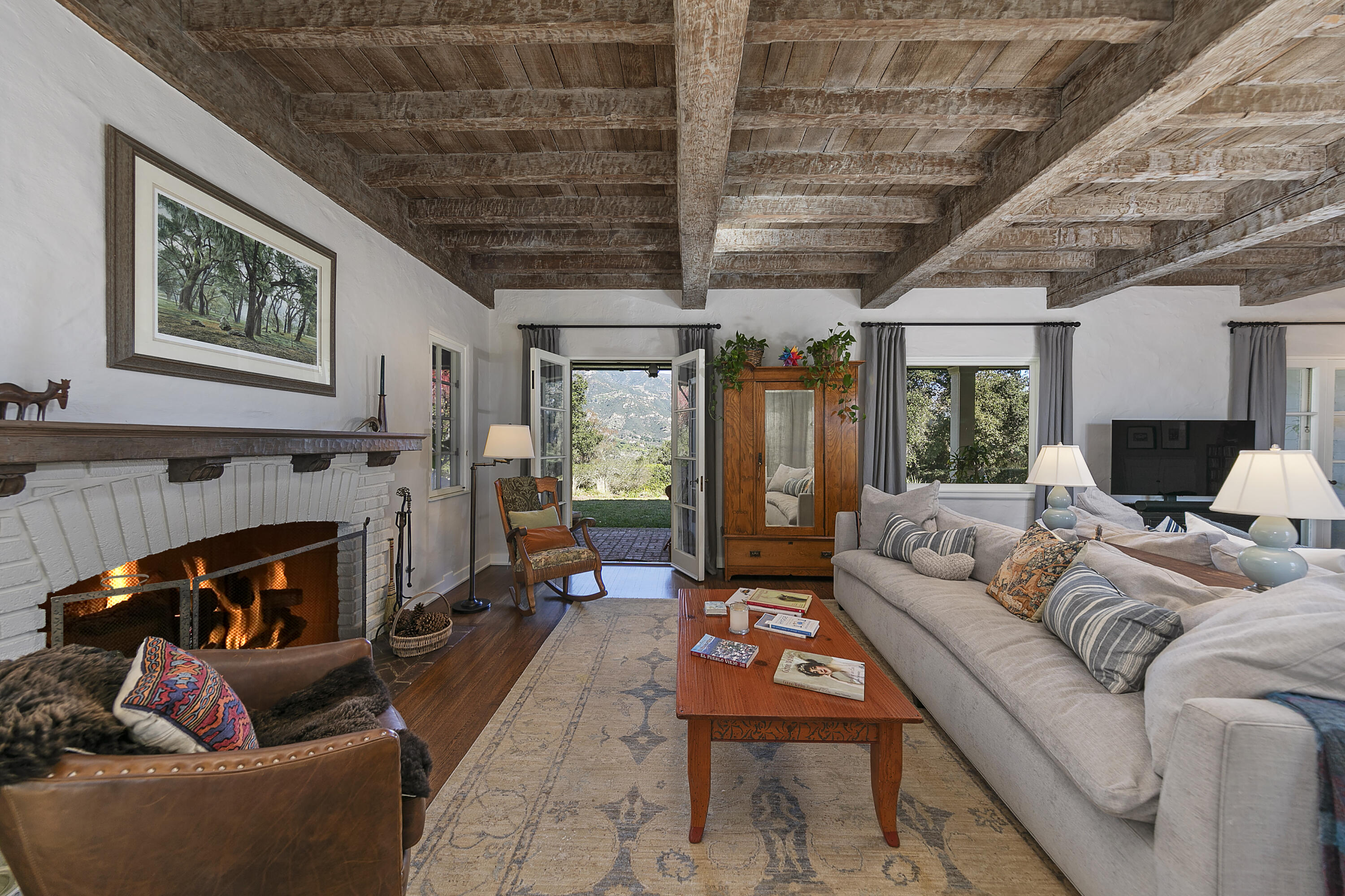 1138 Mission Ridge Road Santa Barbara, CA 93103 - Photo 17 of 54 a living room with furniture and a fireplace