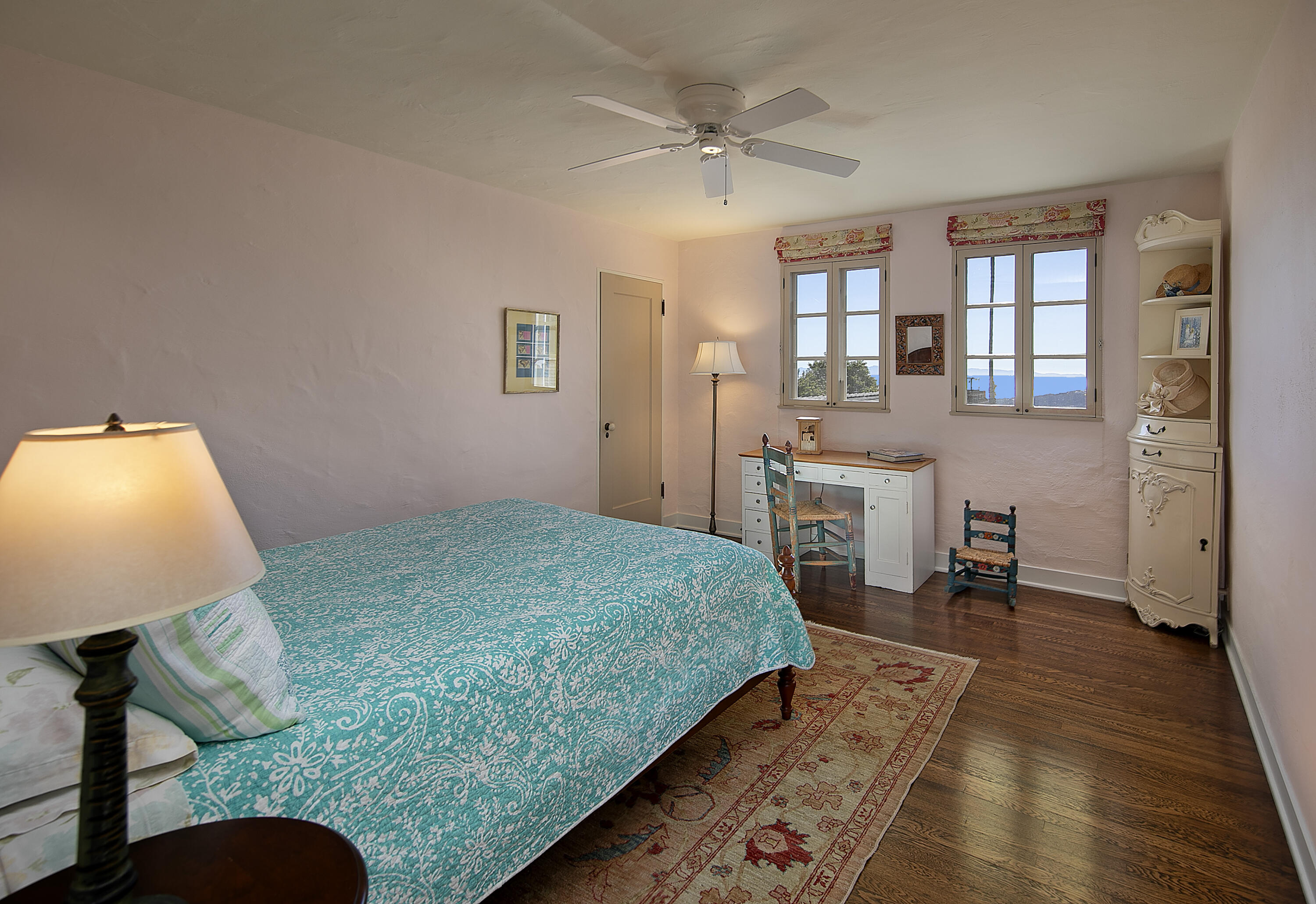 1138 Mission Ridge Road Santa Barbara, CA 93103 - Photo 41 of 54 a bedroom with a bed and wooden floor