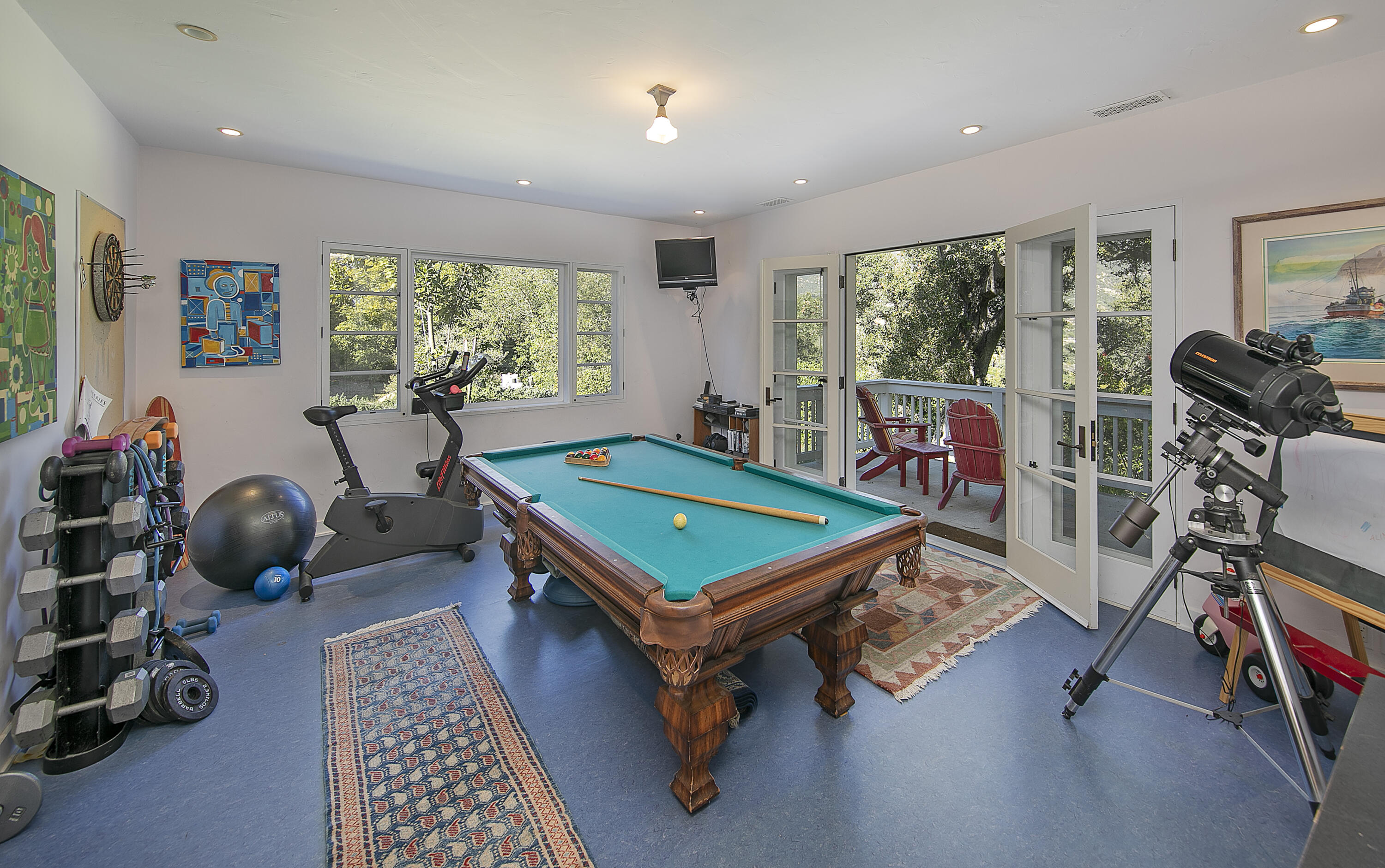 1138 Mission Ridge Road Santa Barbara, CA 93103 - Photo 42 of 54 a room with furniture gym equipment and windows