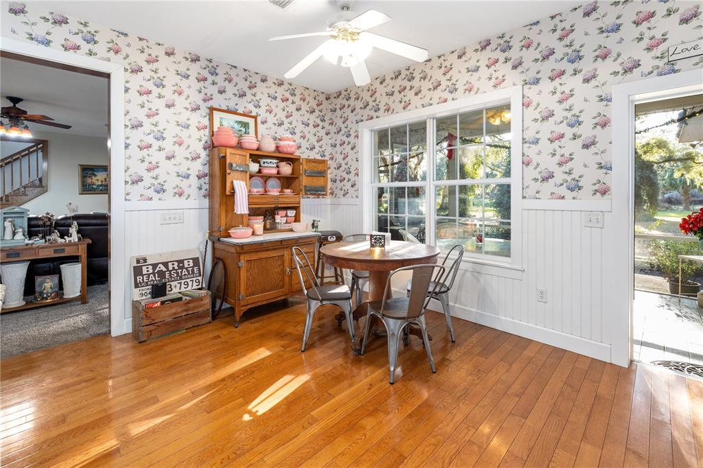 993 Cr 722 Webster Webster, FL 33597 - Photo 11 of 96 a dining room with furniture and wooden floor