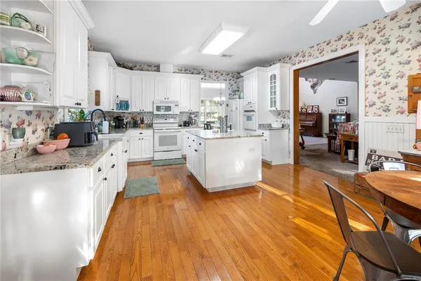 a view of a dining room with furniture and window