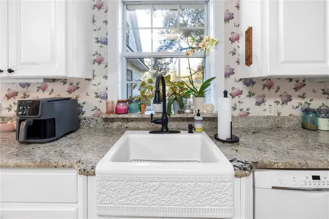 a bedroom with furniture and a wooden floor