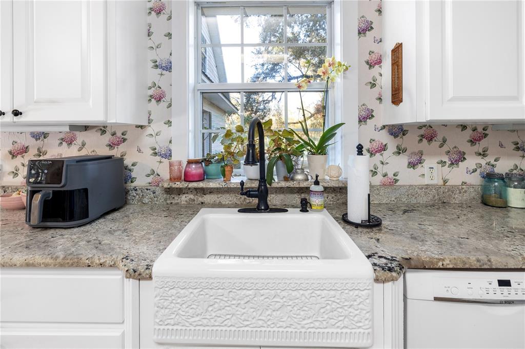 993 Cr 722 Webster Webster, FL 33597 - Photo 14 of 96 a kitchen with granite countertop a sink and a stove