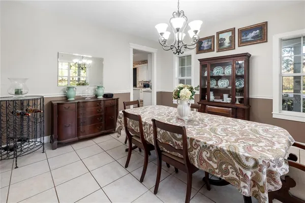a view of a patio with a dining table and chairs