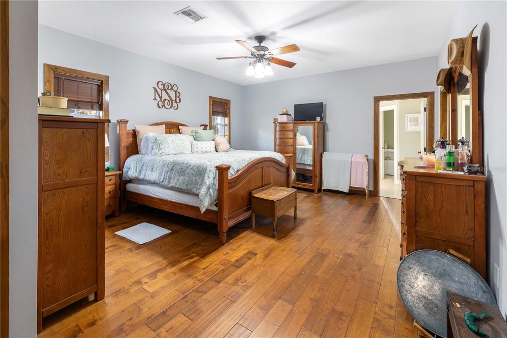 993 Cr 722 Webster Webster, FL 33597 - Photo 18 of 96 a bedroom with furniture and a wooden floor