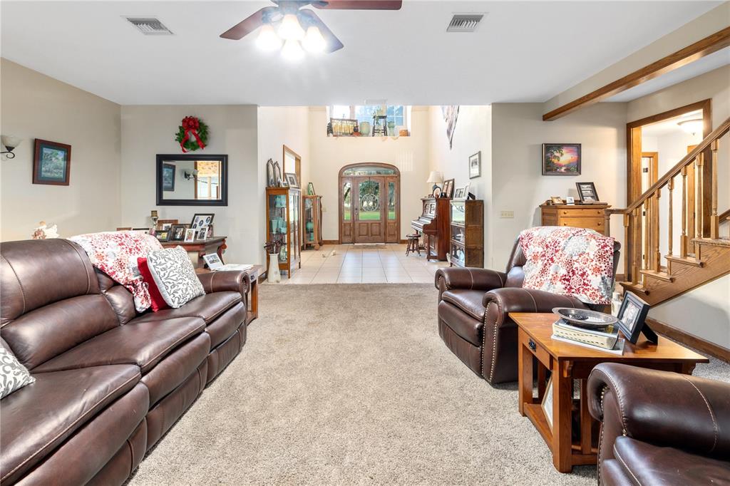 993 Cr 722 Webster Webster, FL 33597 - Photo 39 of 96 a living room with furniture fireplace and a large window