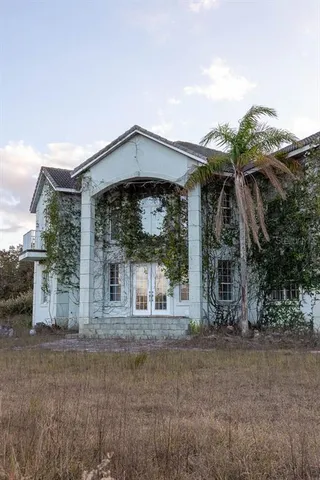 a view of a lake with houses in the back