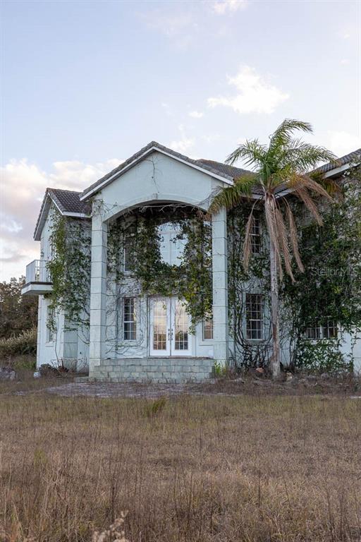993 Cr 722 Webster Webster, FL 33597 - Photo 49 of 96 a front view of a house with a yard