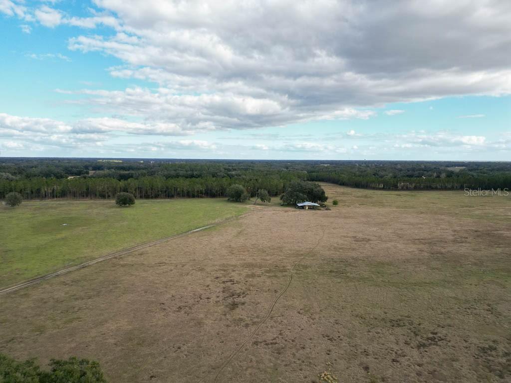 993 Cr 722 Webster Webster, FL 33597 - Photo 71 of 96 a view of a lake with houses in the back